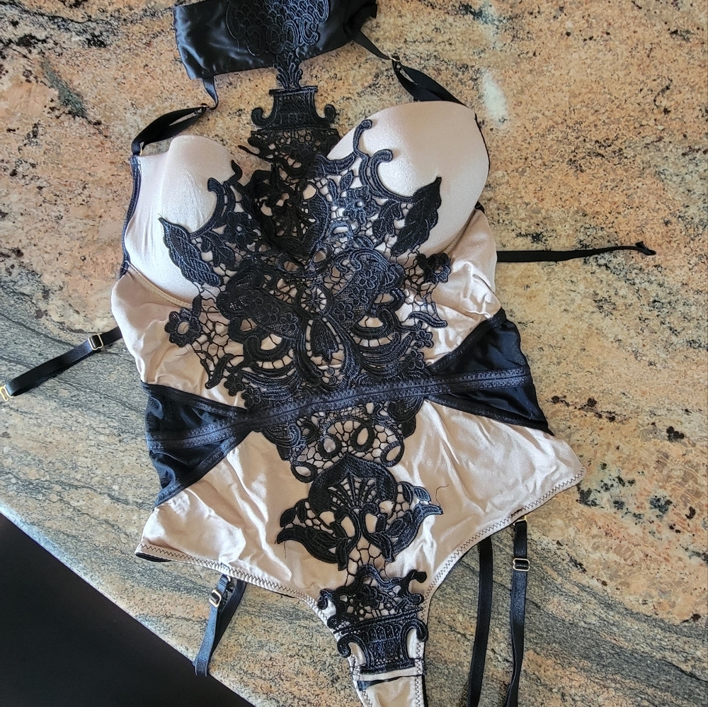 Black and tan lace lingerie bodysuit. Appliqué detail. Size L